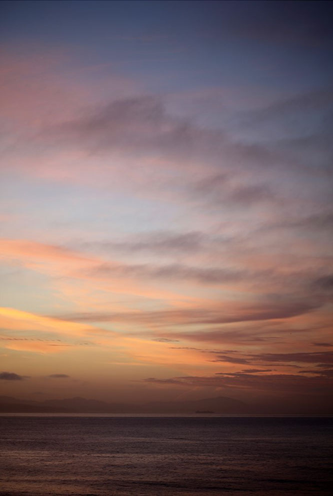 Tim Burns' photograph of cloudy sunset. Soft pinks, oranges and blues. Fuji Color crystal archive DP II acrylic glass (matte) maple frame