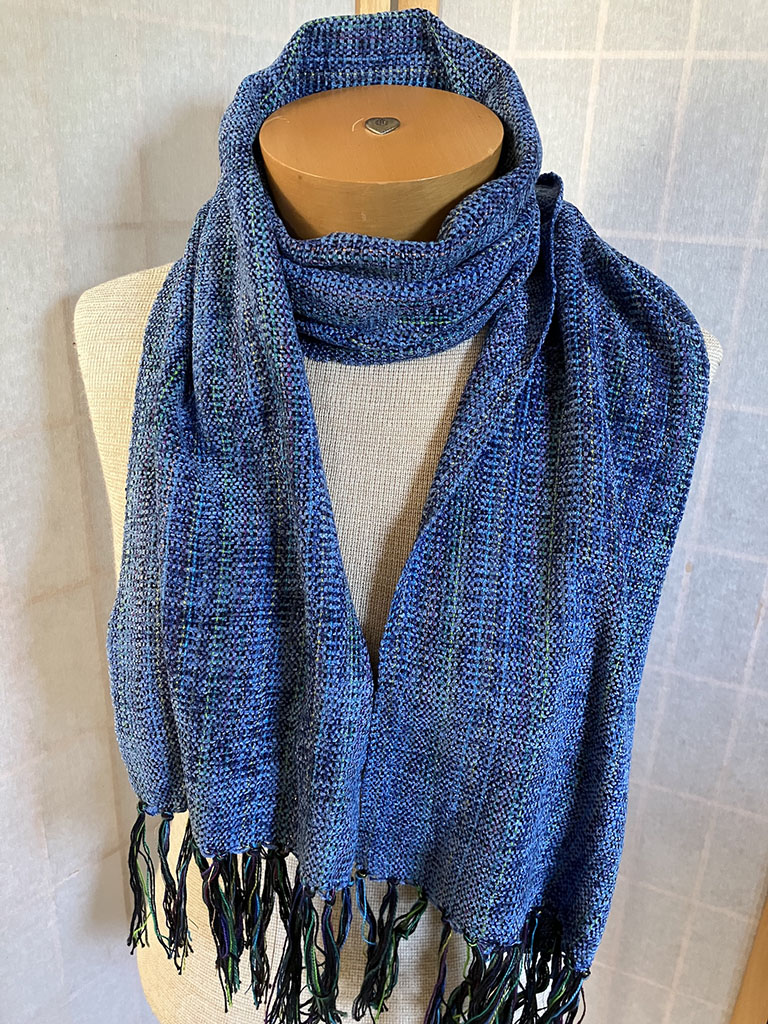 Abby Bard's handwoven scarf in blues with a touch of metal yarn to shine