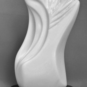 Easton's white Italian marble sculpture on black Indian granite base. Vertical lines in white granite flowing and curving gracefully upwards