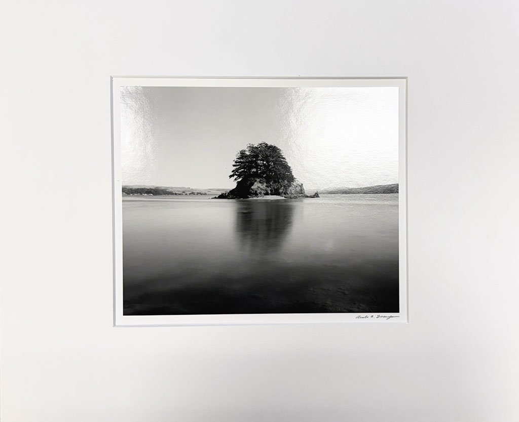Austin Granger's black and white photograph of Photograph of Duck Island from Hog Island, Tomales Bay. August 2003.