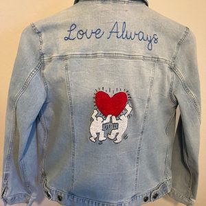 Eileen Morabito's hand embroidered denim jacket with a red heart and the words "love always"