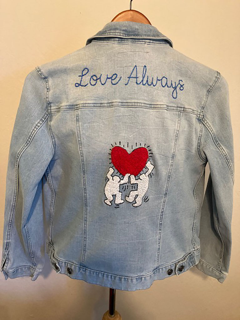 Eileen Morabito's hand embroidered denim jacket with a red heart and the words "love always"
