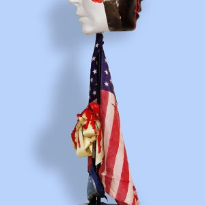 Susandra Spicer's assemblage sculpture with American flag and broken face