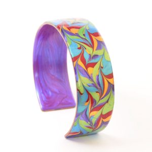 Ava Austin's copper bracelet in pride colors