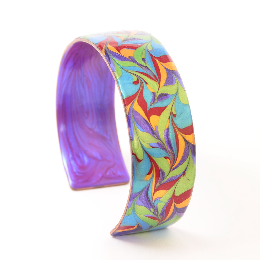 Ava Austin's copper bracelet in pride colors