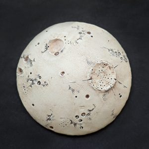 Robyn Beattie's ceramic piece depicting the face of the moon
