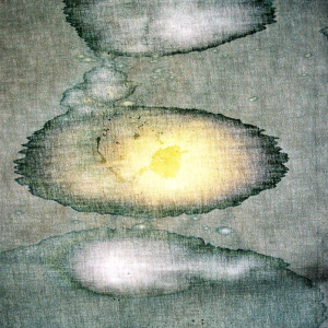 John Caulfield-Valganon's bleach painting on unstretched linen. Grey, white and yellow circles
