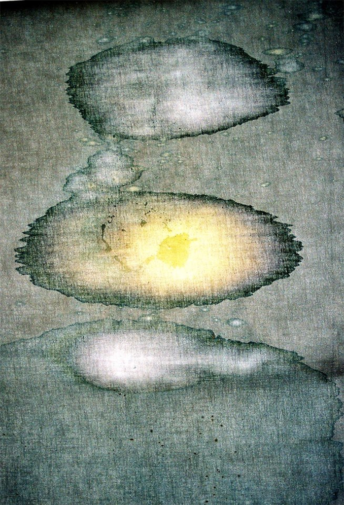 John Caulfield-Valganon's bleach painting on unstretched linen. Grey, white and yellow circles