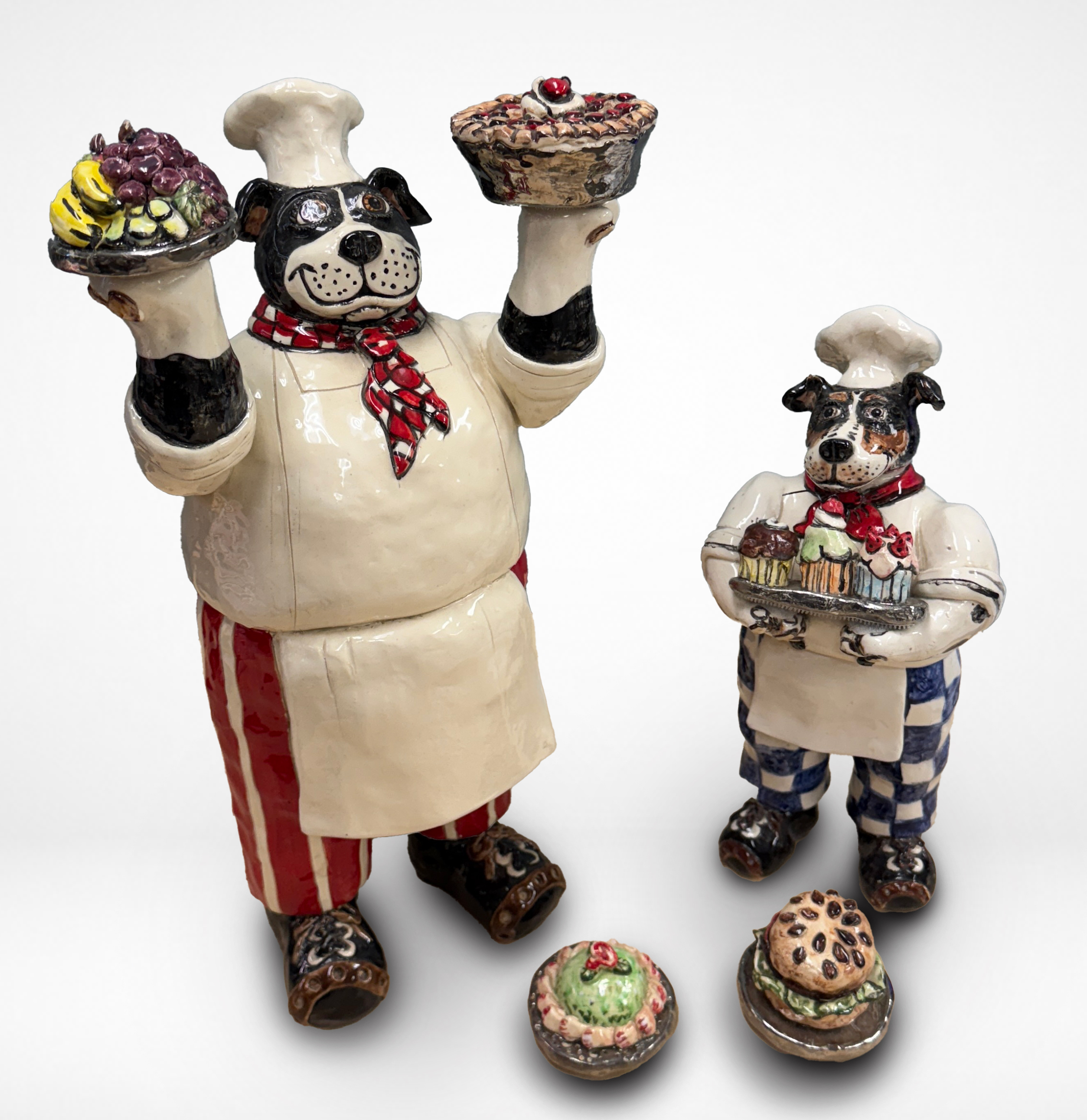 Cynthia Hipkiss' hand built sculptures of two dogs dressed as chefs