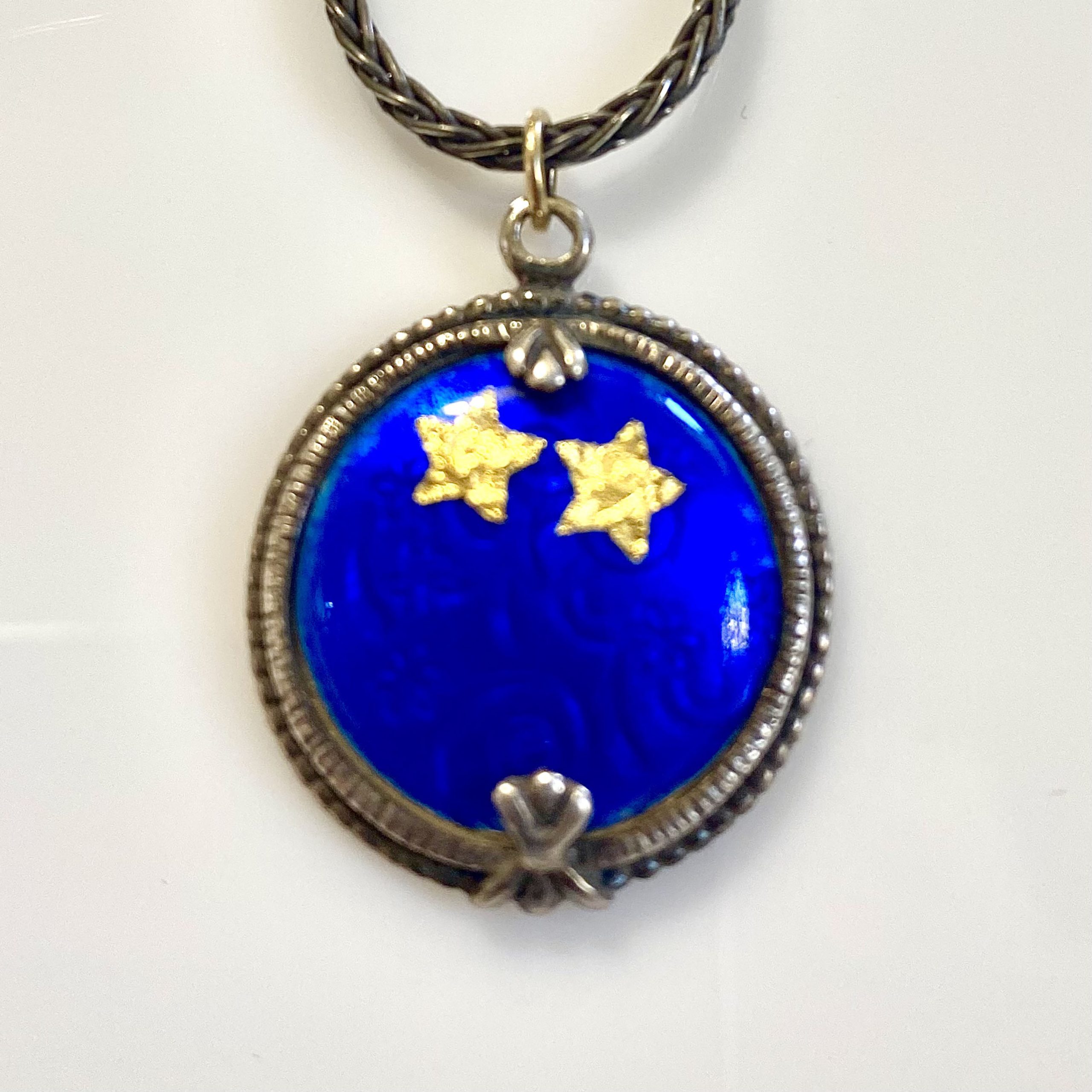 Anita Selinger's sterling silver with, blue vitreous enamel pendant with blue background and two gold stars, 18k and 24k gold