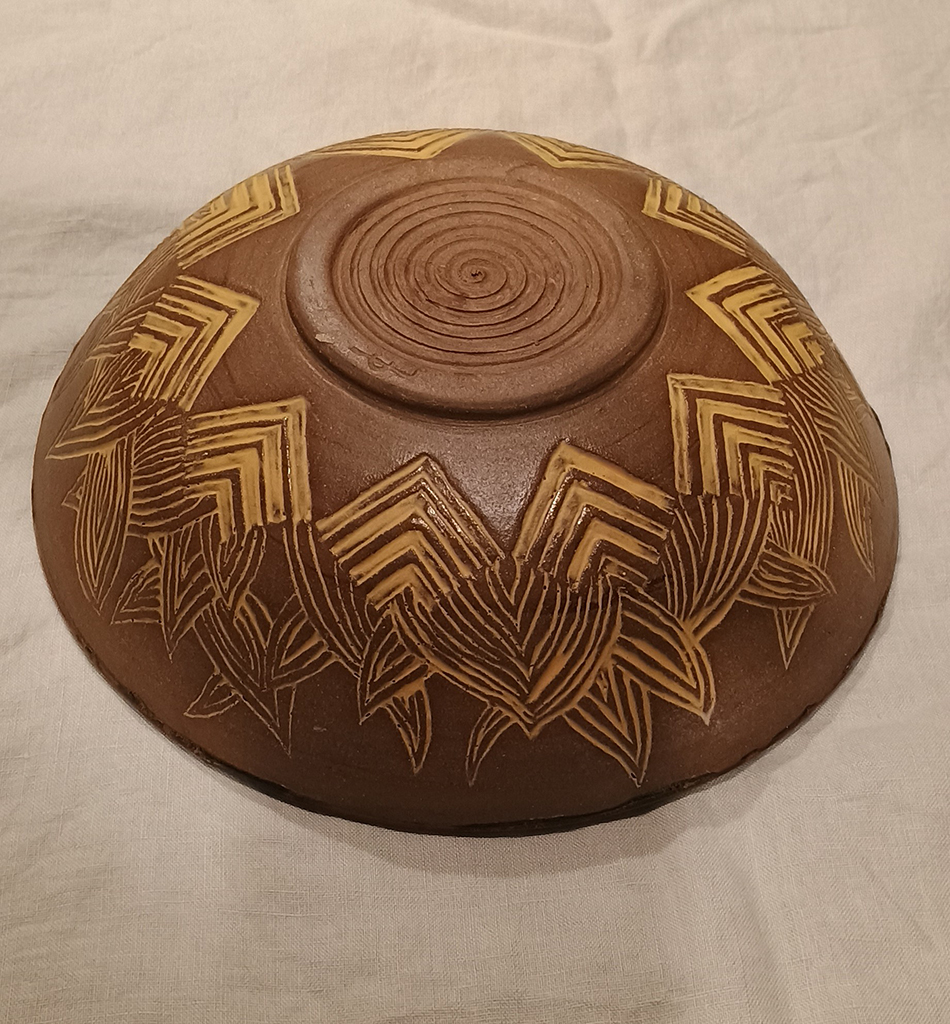 Caroline Lapere's Carved bowl, glazed on the inside, burnished raw clay on outside