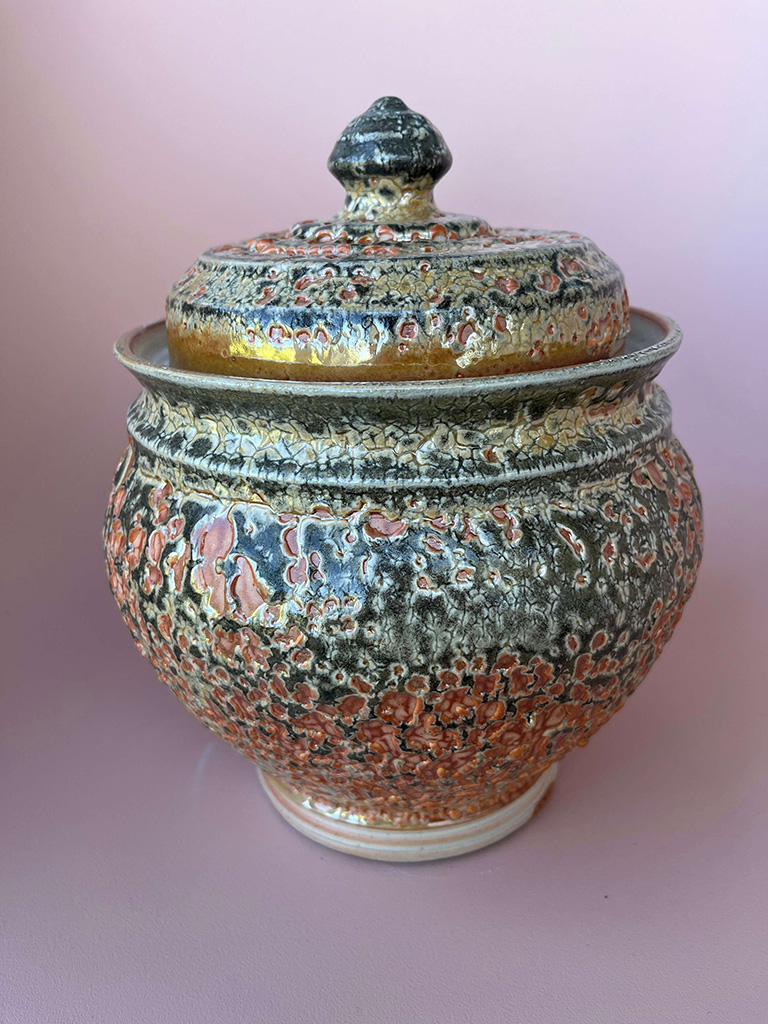 Roy Zajac's ceramic fermentation jar in greens and burnished browns