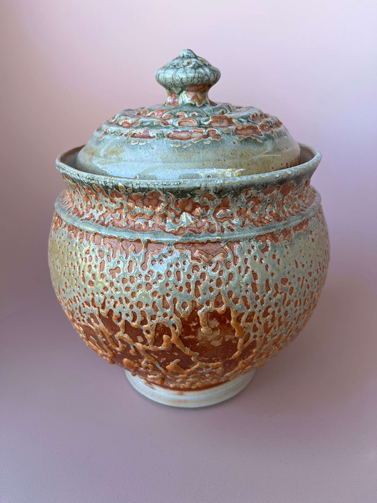 Roy Zajac's high fire ceramic fermentation jar in green with brown burnished highlights