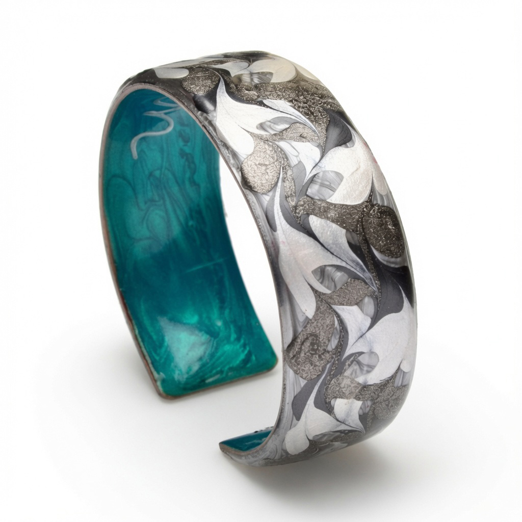 Ava Austin's copper cuff enameled with artist's proprietary technique, fully adjustable and waterproof with silver/grey exterior and teal interior