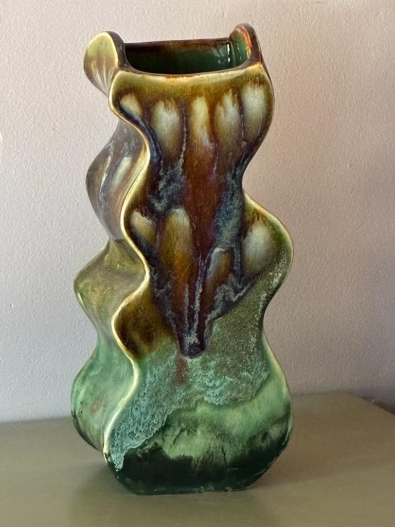 Laney Weil's Hand built abstract design vase, medium fire clay, with multilayered glaze elements in greens and golds.